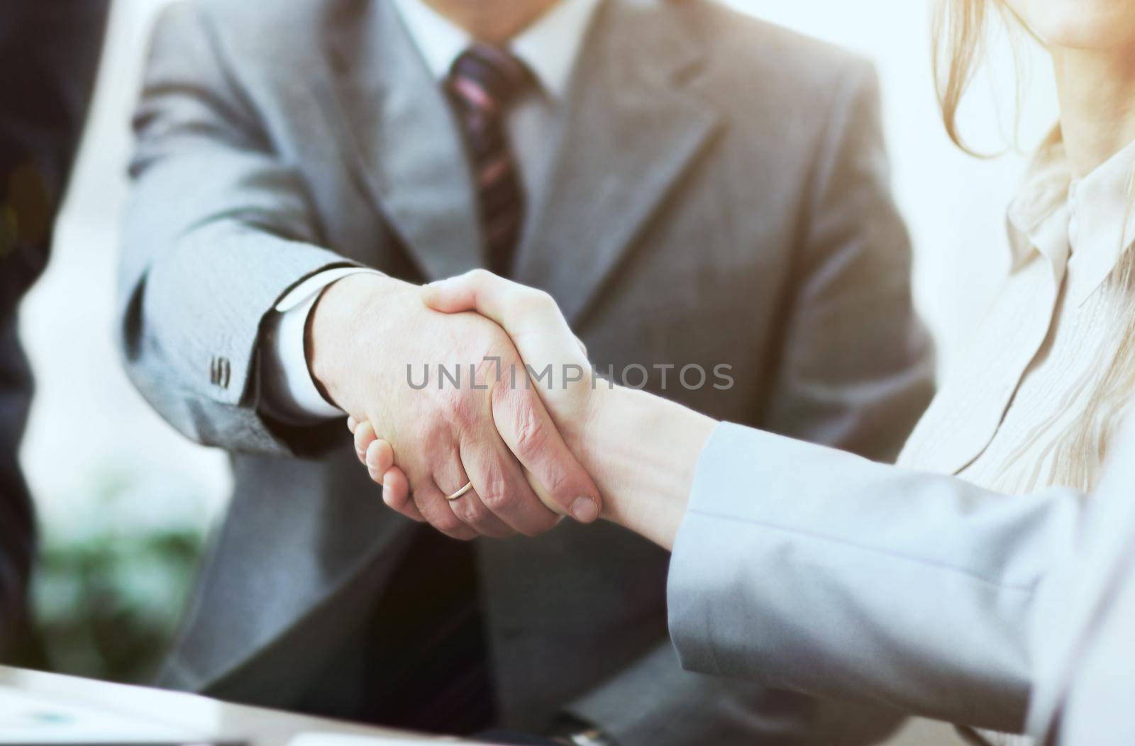 Business people shaking hands, finishing up a meeting