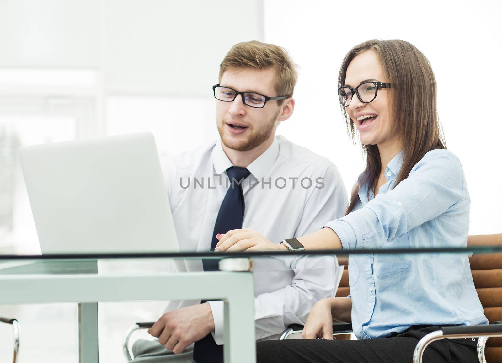 experienced staff of the company discuss the current problems at the Desk in the conference room.the photo has a empty space for your text