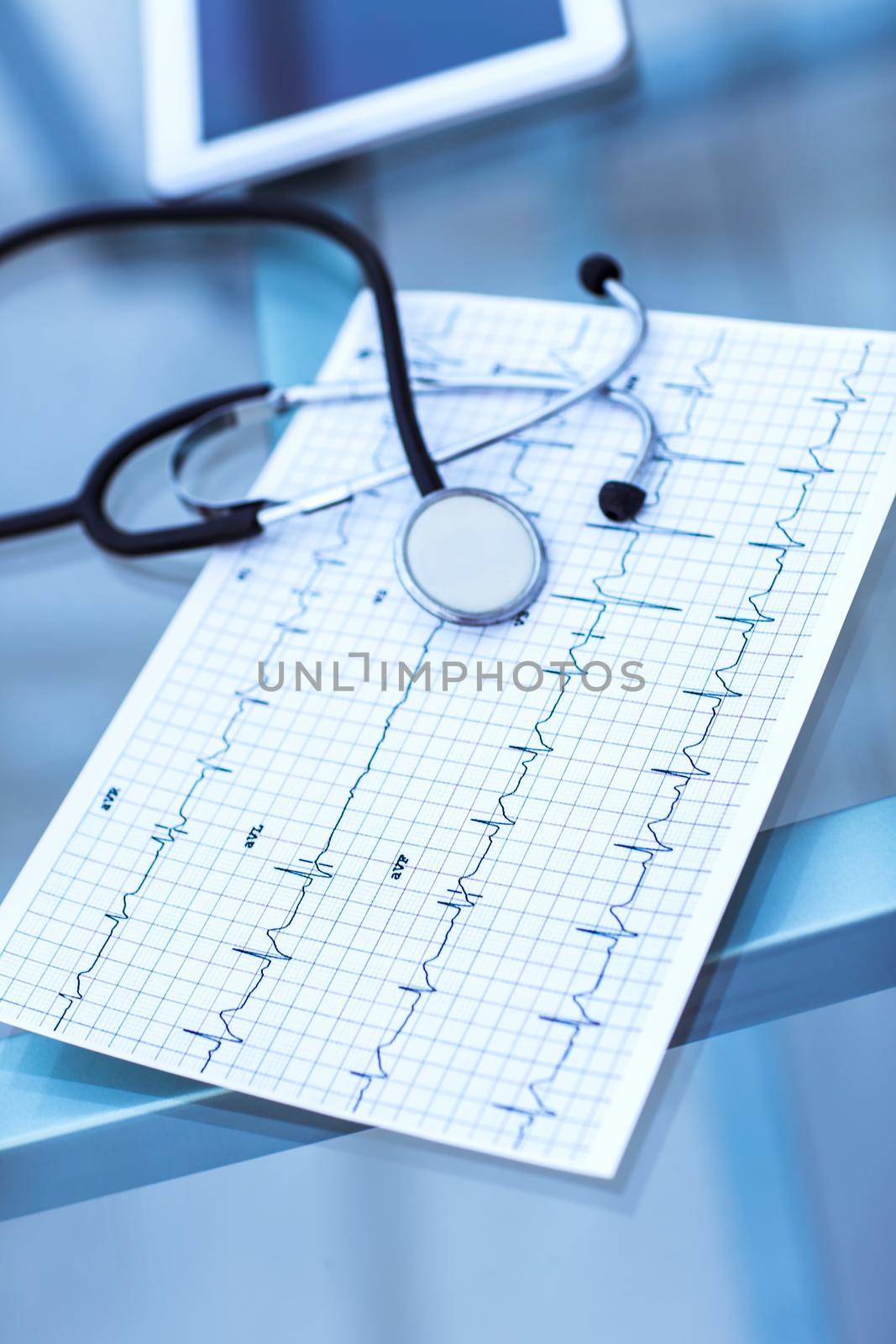 stethoscope and electrocardiogram on the table from the therapist.the photo is a blank space for your text
