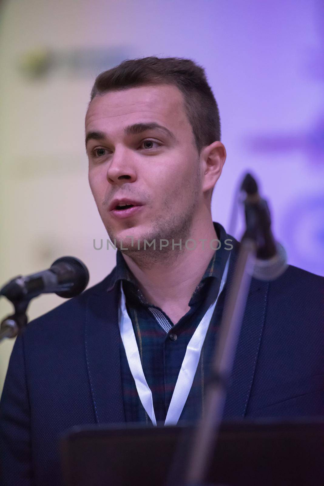 young businessman at business conference room with public giving presentations. Audience at the conference hall. Entrepreneurship club