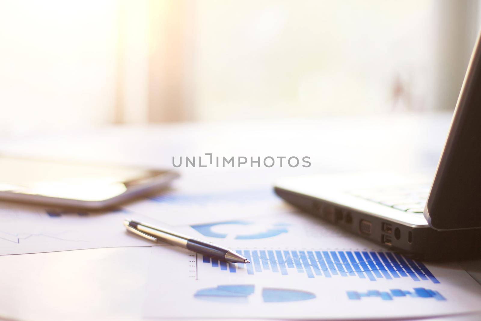 Workplace, analysis of graphics pen and tablet with laptop and performance of calculations in office