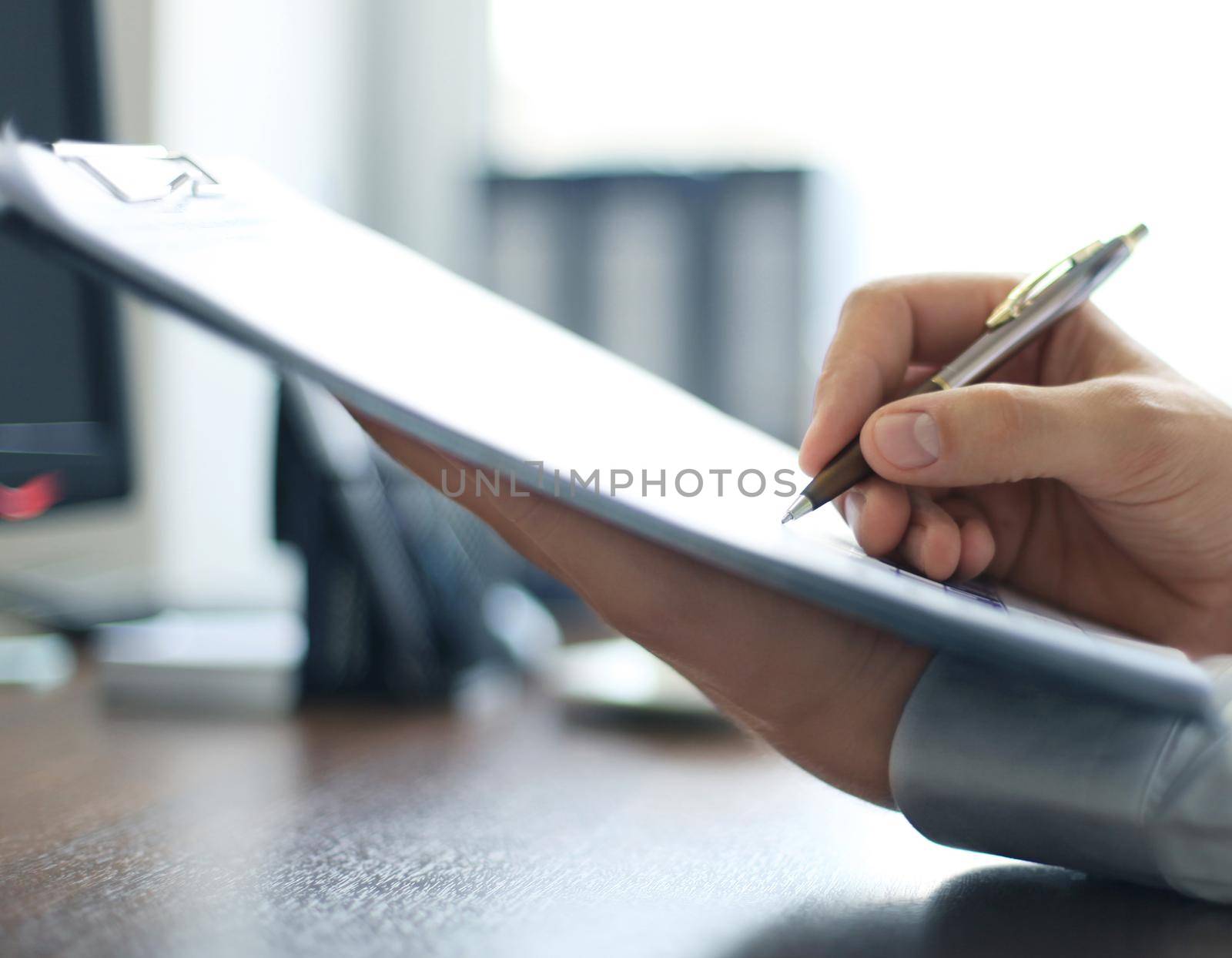 Business lady taking business notes at office