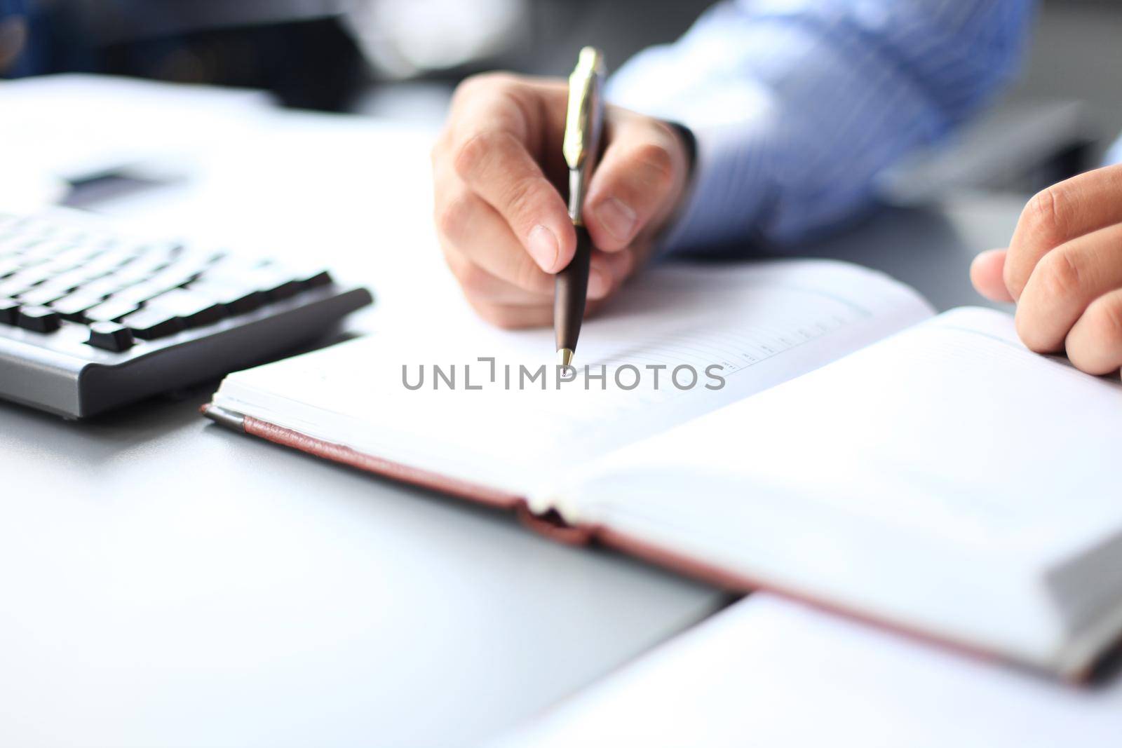 Business lady taking business notes at office