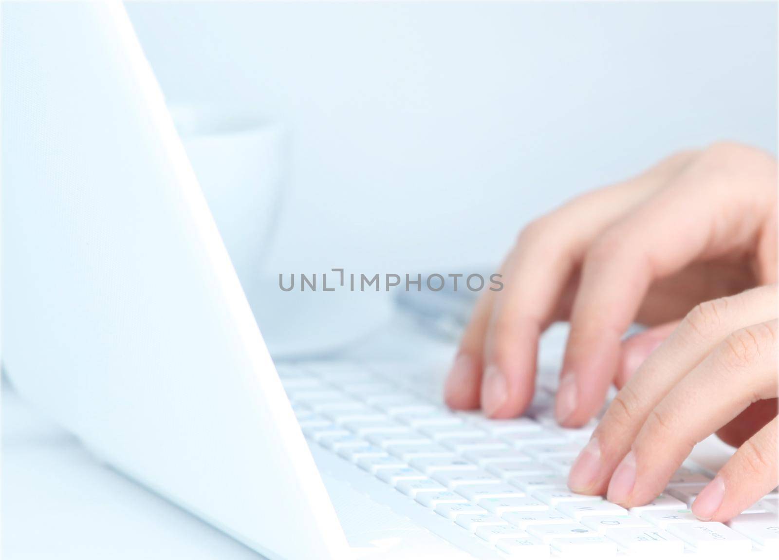 Close-up Of Female Hand Typing On Keyboard by tsyhun