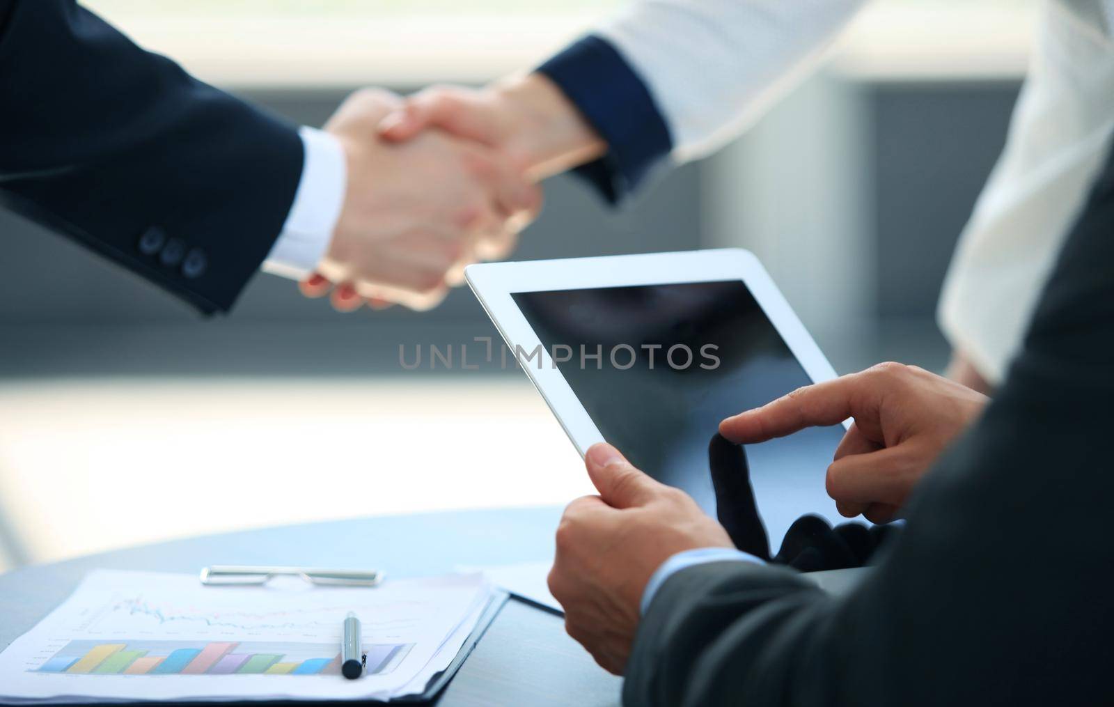 Businessman holding digital tablet by tsyhun