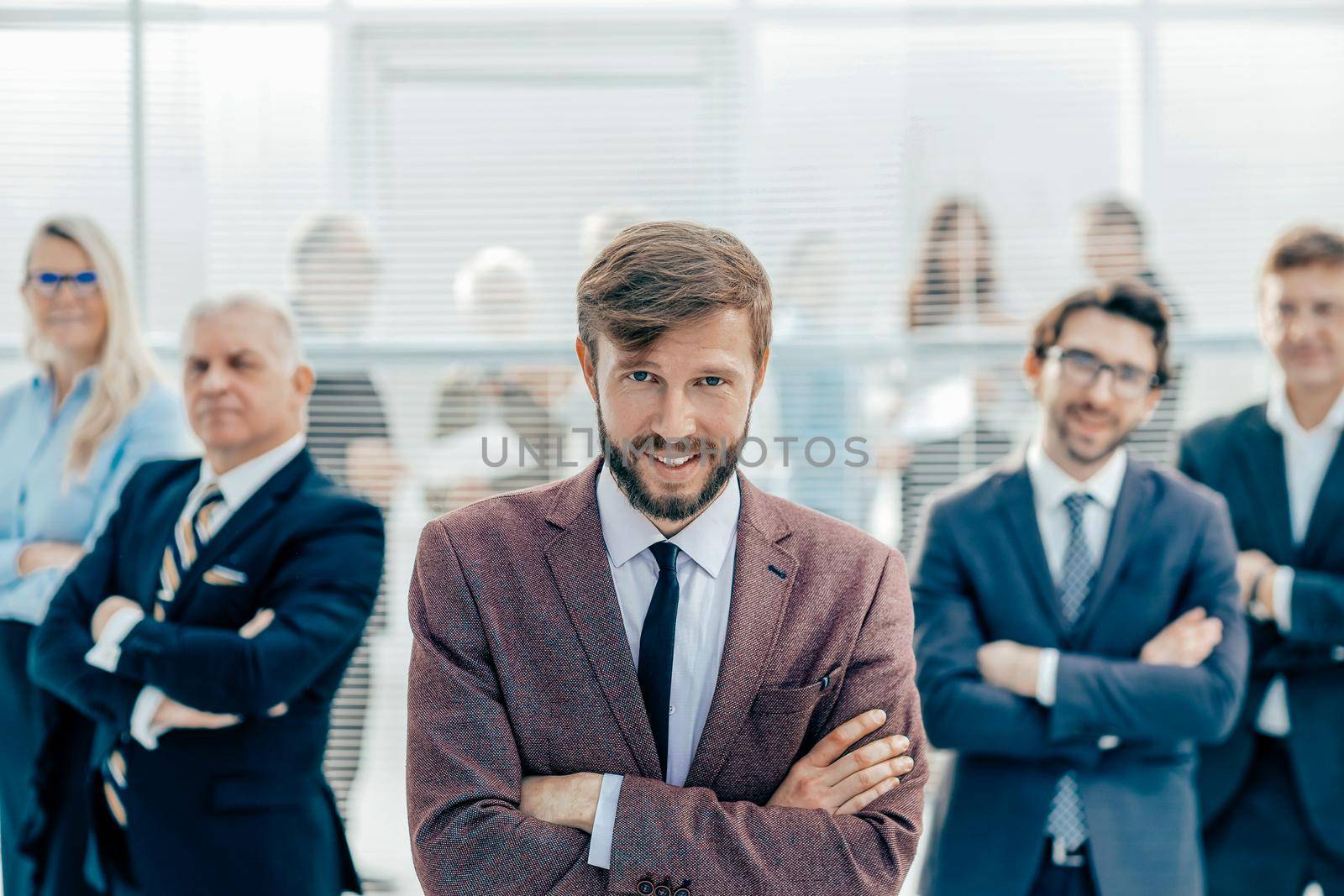 close up. happy young entrepreneur standing in the office