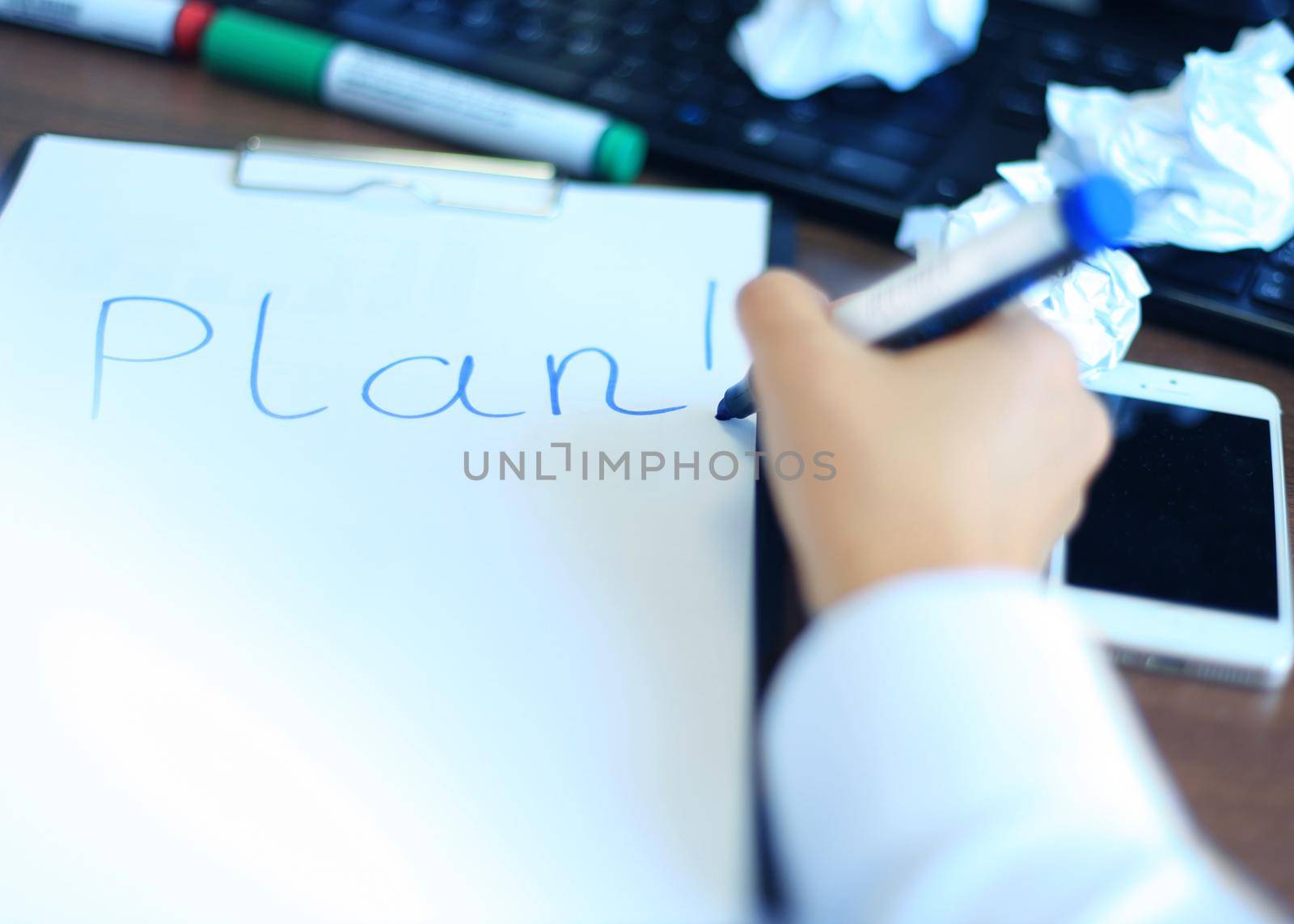 Business woman writing blank plan list