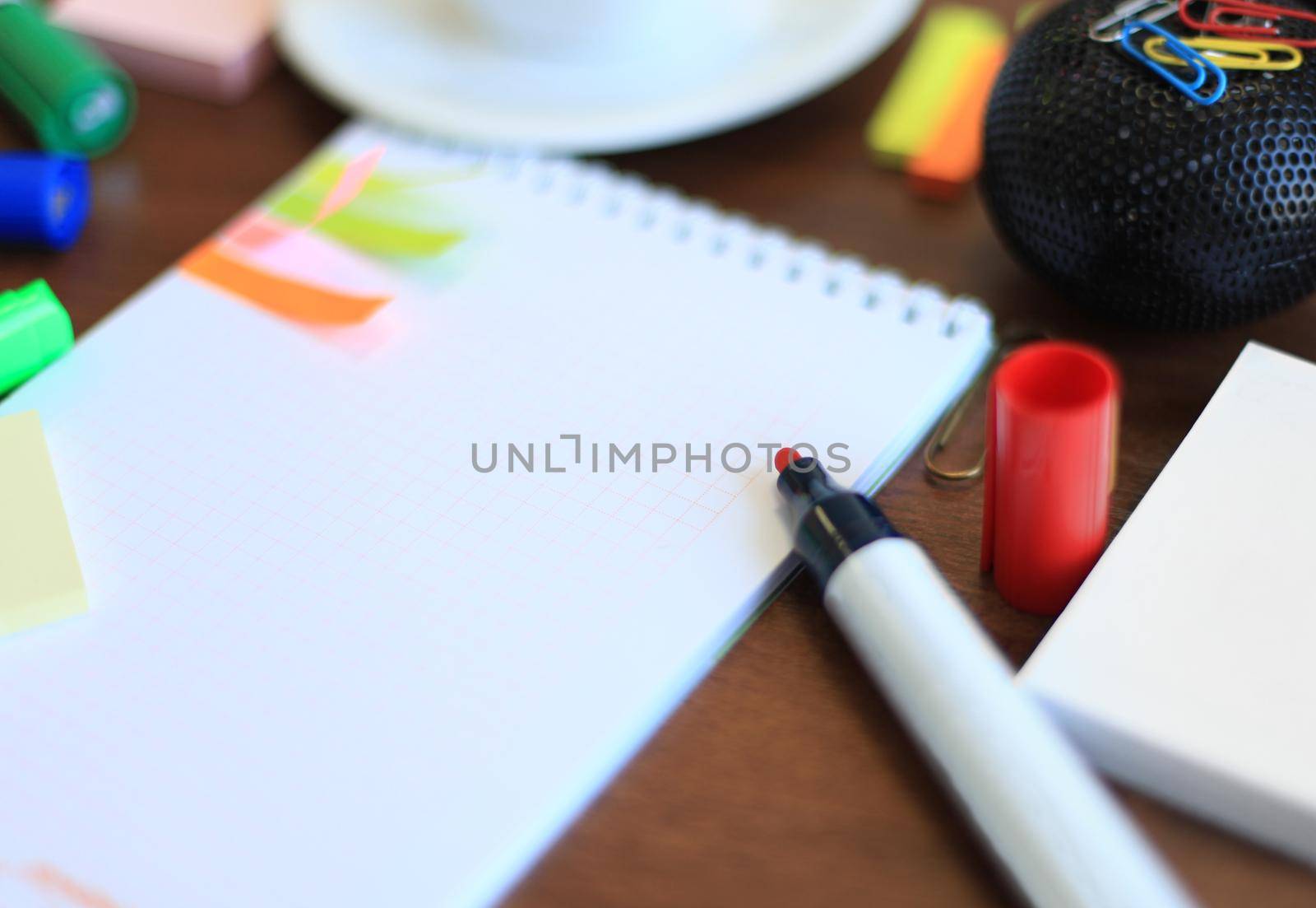 blank sheet and stationeries with cup of coffee on the table