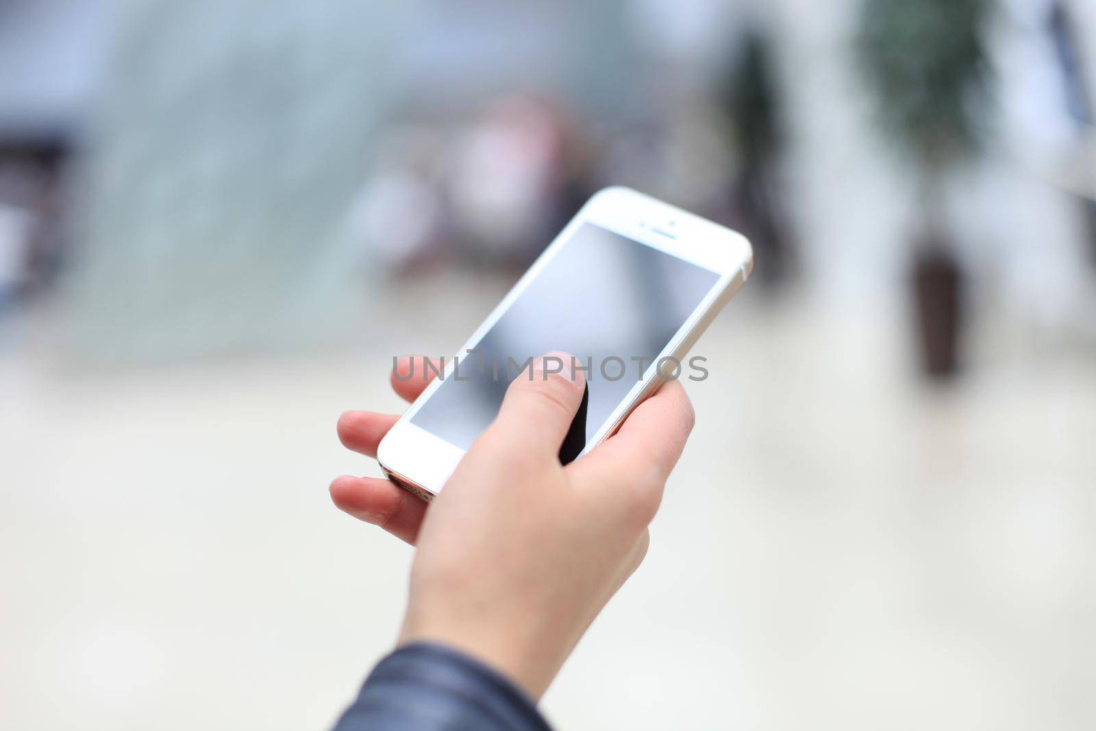 Close up of a woman using mobile smart phone