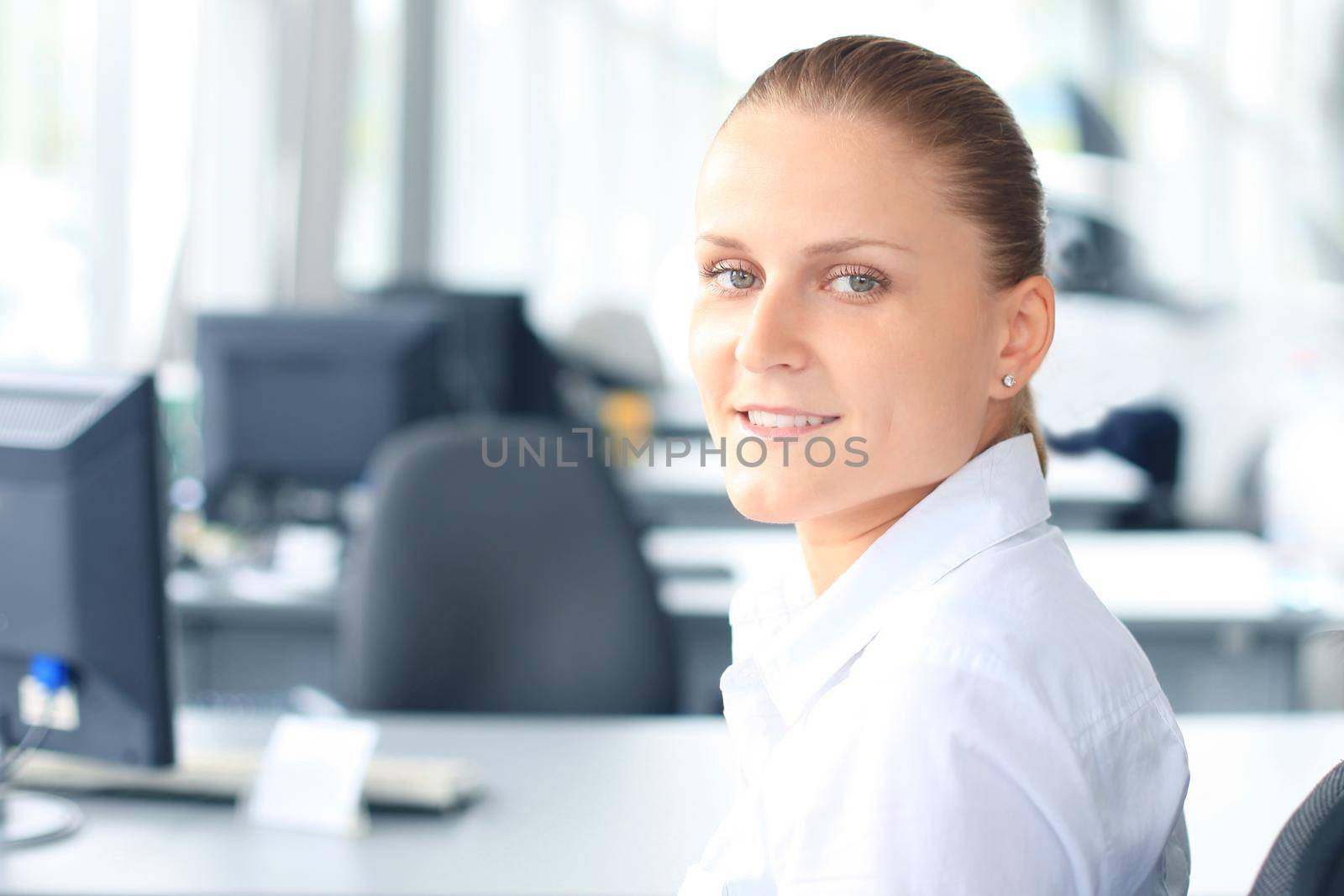 Closeup portrait of cute young business woman smiling