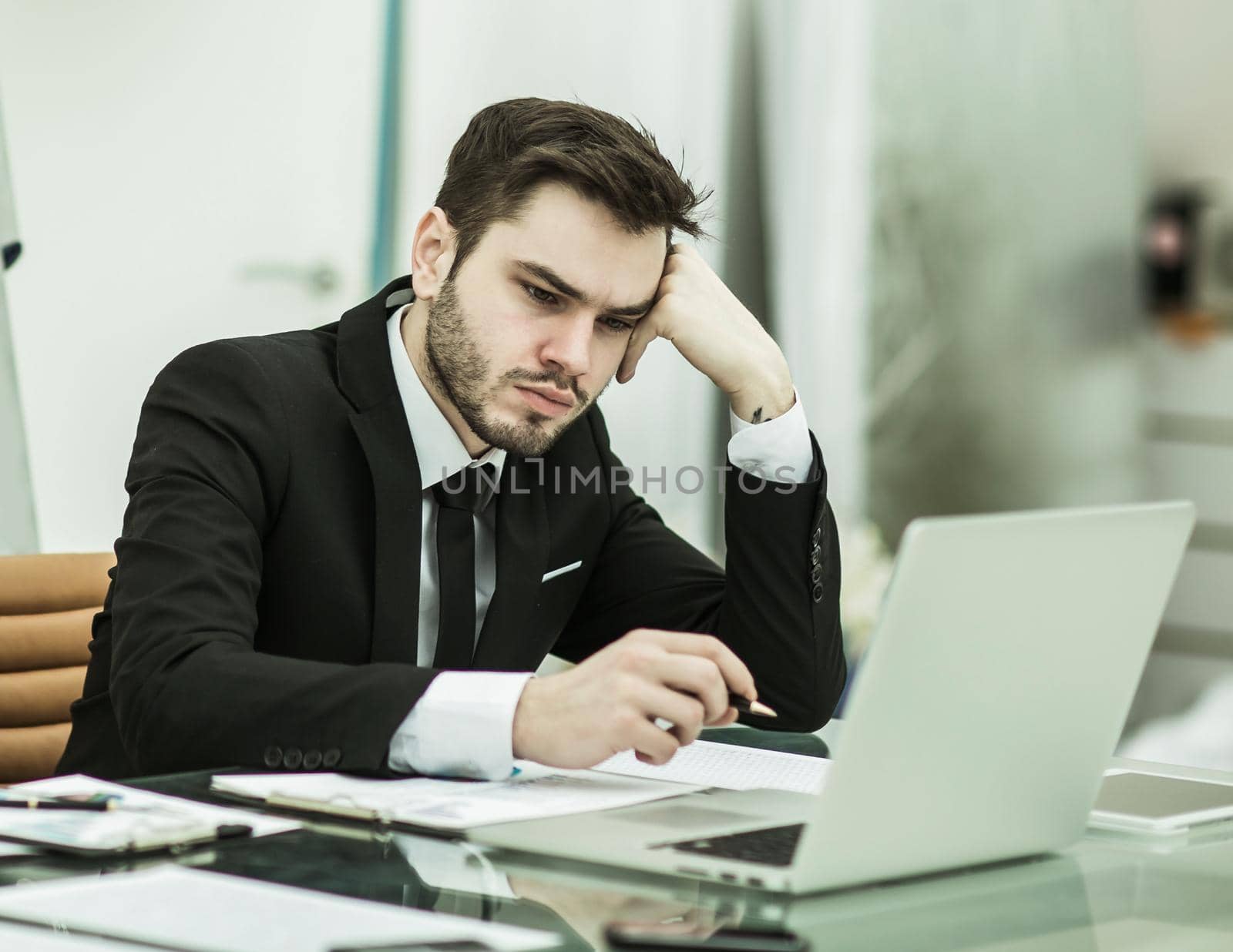 businessman working with financial documents at Desk in modern office