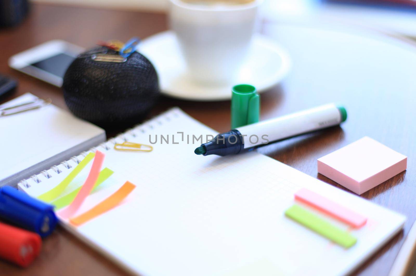 blank sheet and stationeries with cup of coffee on the table