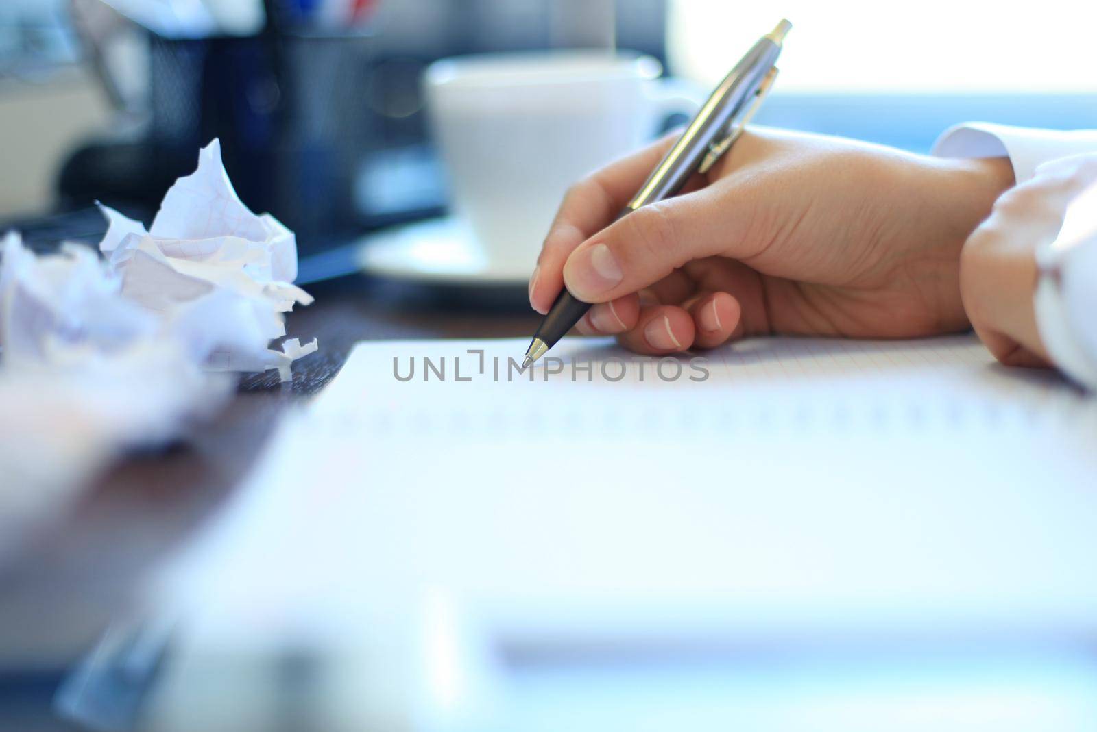 Close-up of Businesswoman makes a note at business document by tsyhun
