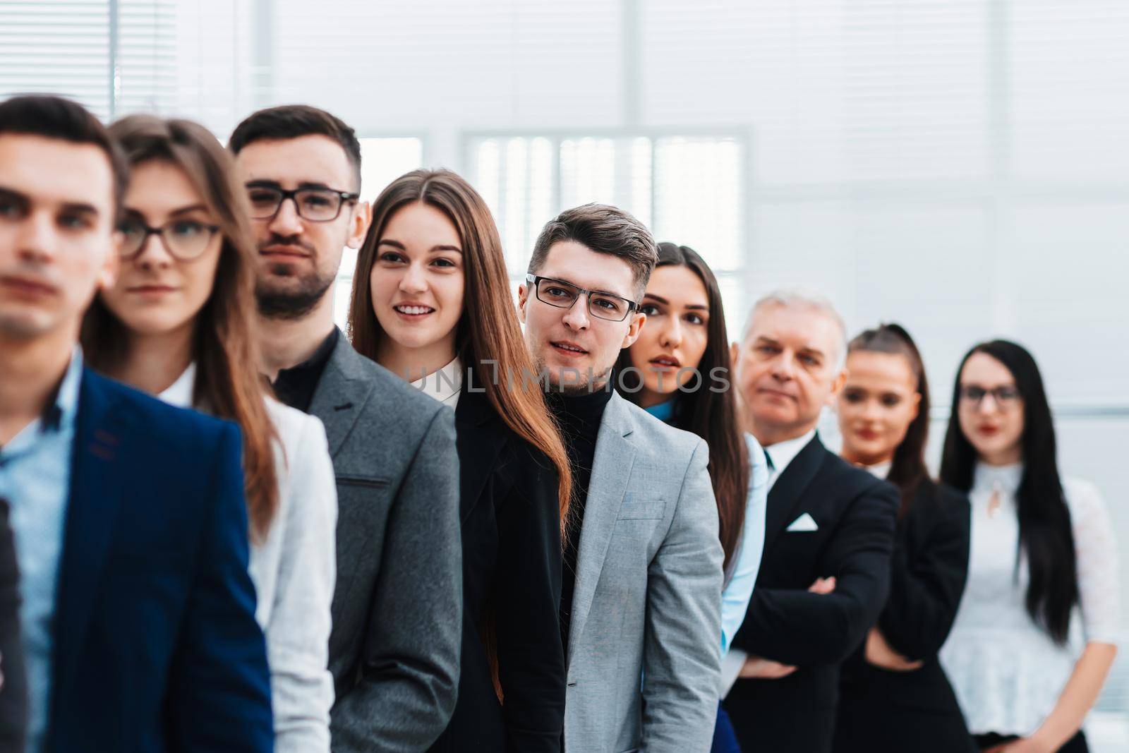 large group of diverse business people standing in a row. business concept