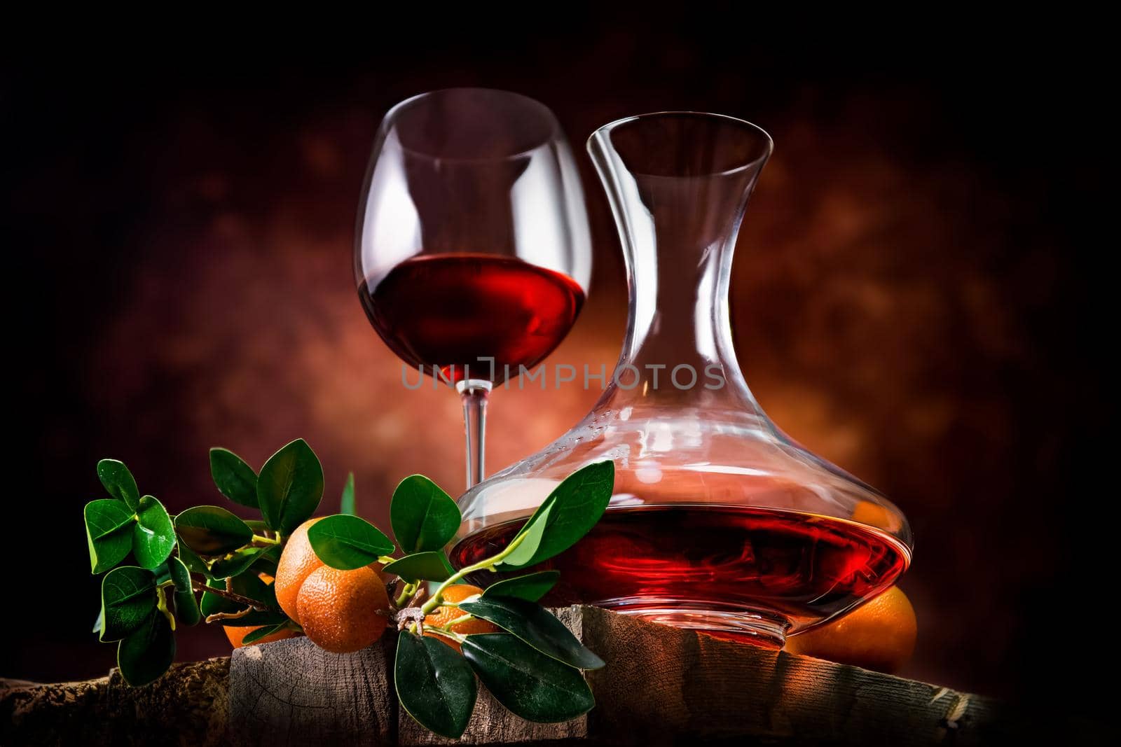 Tangerine wine on a wooden table by Givaga