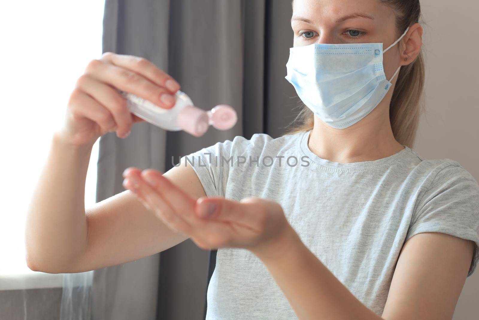 Woman using sanitizer hand gel. Hand hygiene coronavirus protection. by tsyhun
