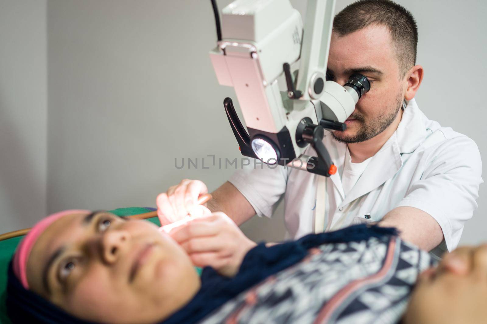 Muslim woman under medical checkup of the ear