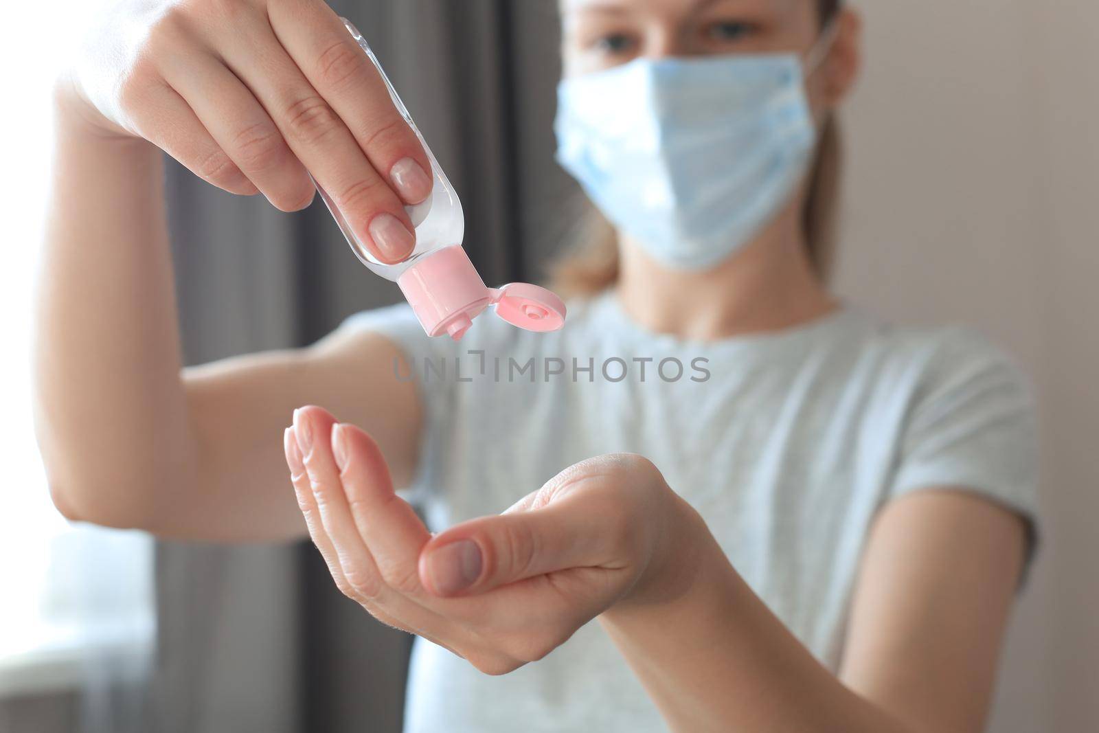 Woman using sanitizer hand gel. Hand hygiene coronavirus protection