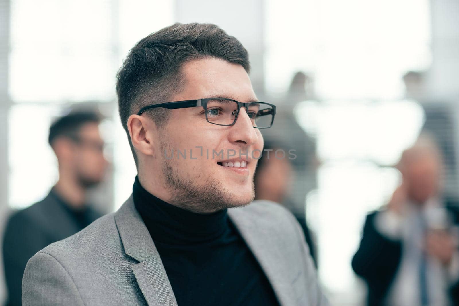 close up. confident business man standing in the office