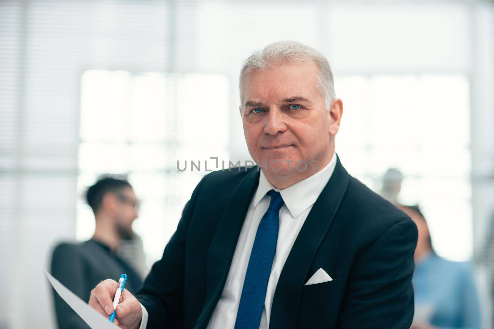 close up. investment consultant checking a business document by SmartPhotoLab