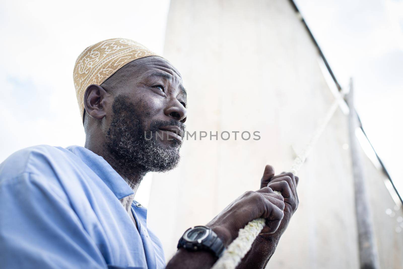 Black man sailing on boat