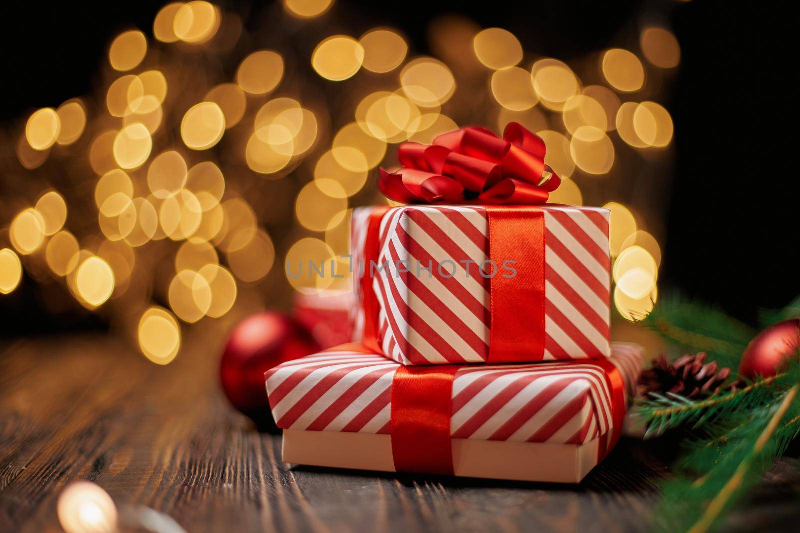 boxes with gifts on the background of Christmas lights. by SmartPhotoLab