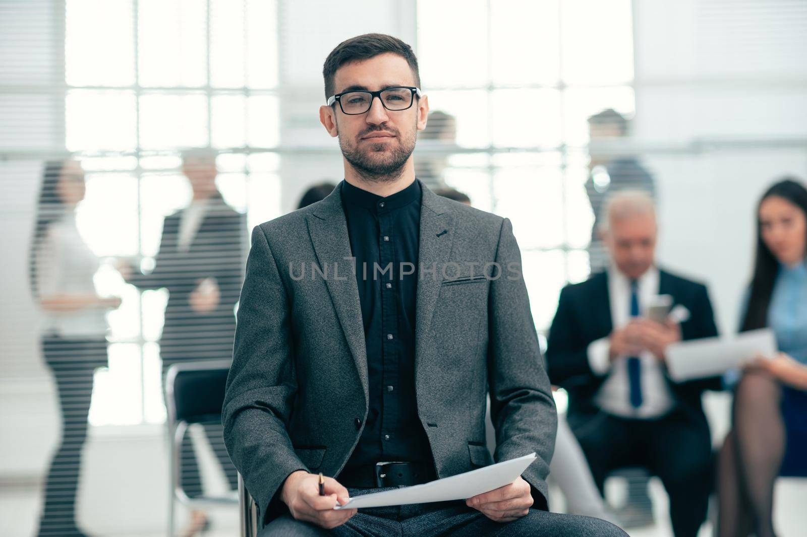 close up. financial consultant sitting in a modern office. work with documents