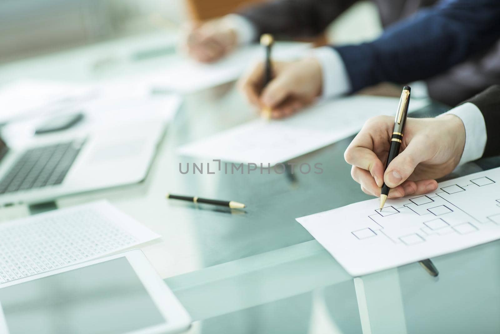 closeup of business team is working with financial charts.the photo has a empty space for your text