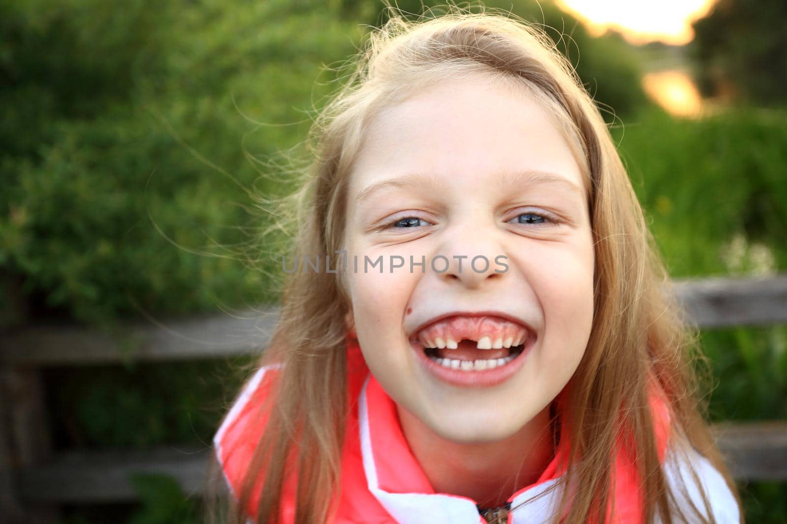 smiling little girl in a Park in autumn day