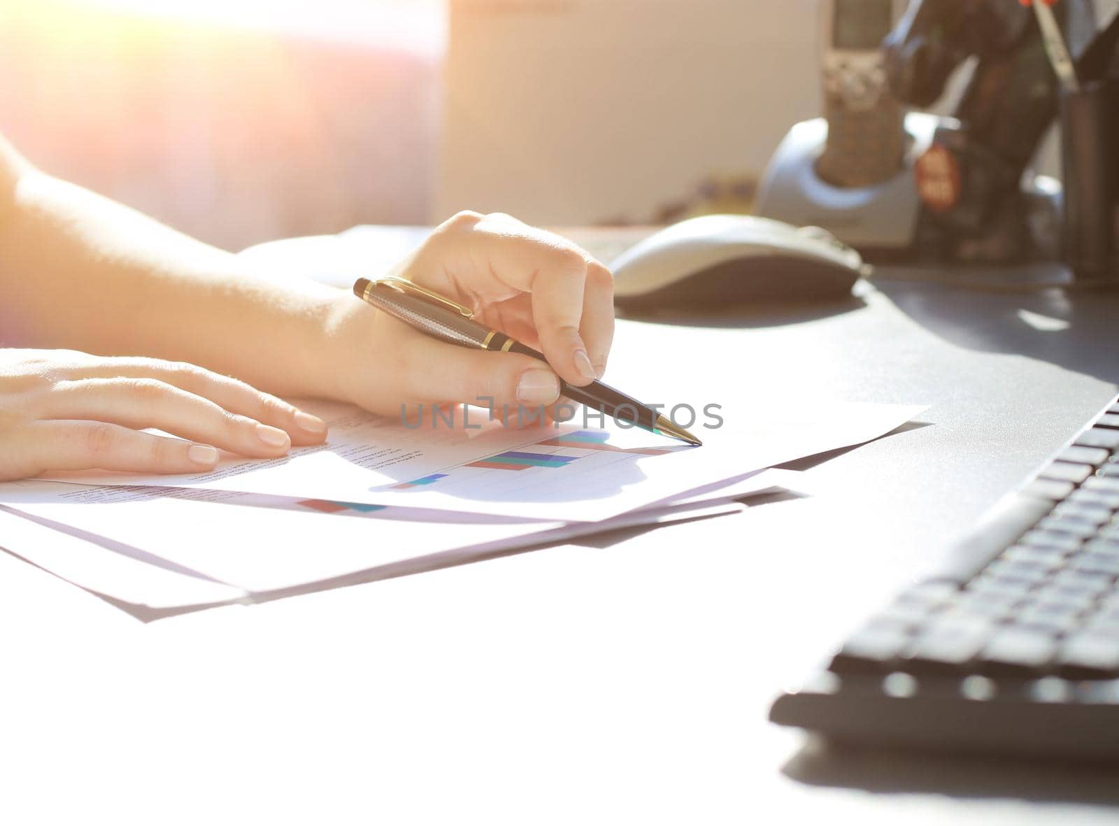 Business Woman Writing with pen in the office