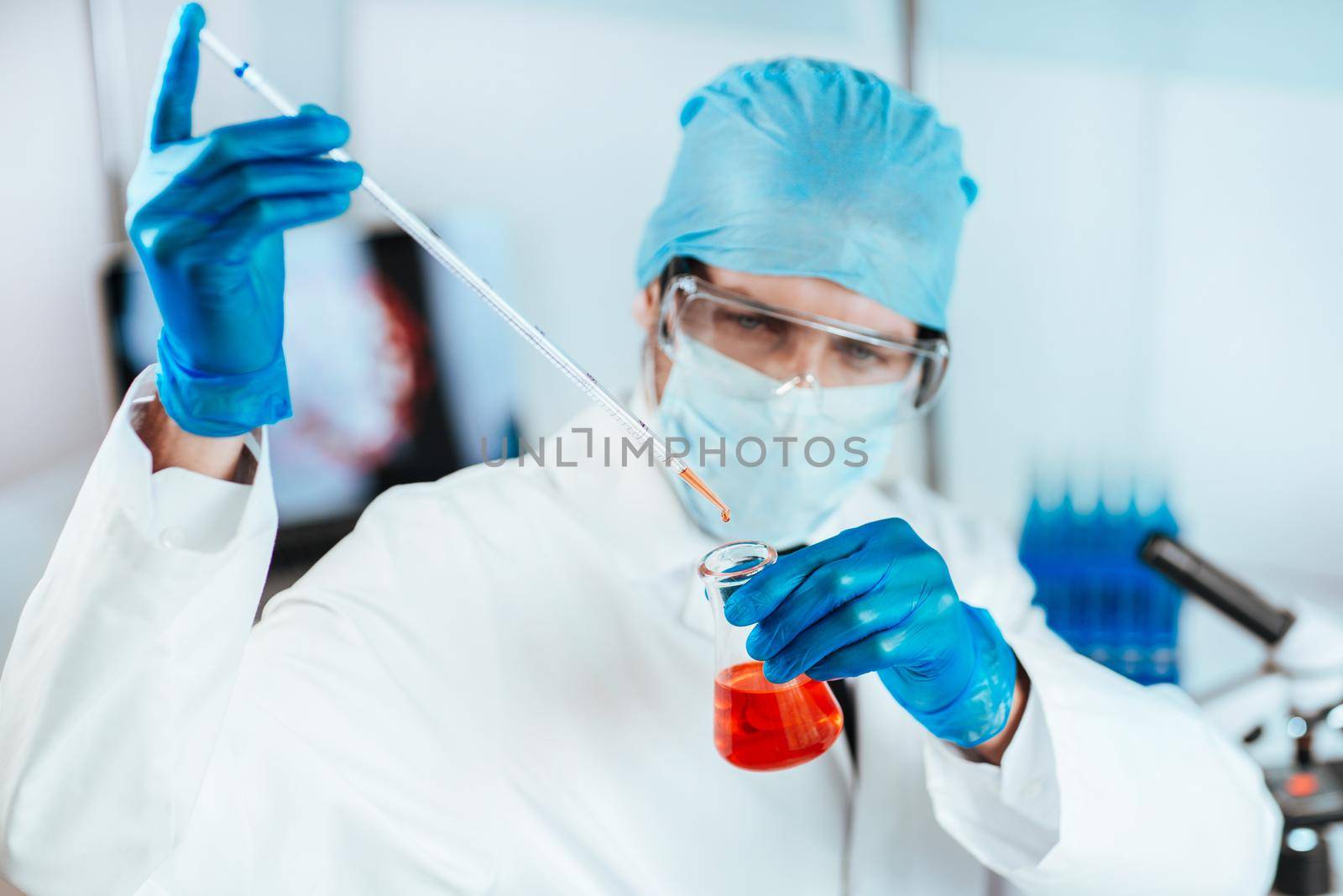 close up. scientist conducts research in the laboratory. by SmartPhotoLab