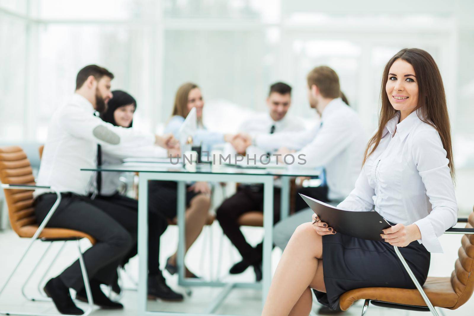 leading lawyer of the company on background, business meeting business partners. the photo has a empty space for your text.