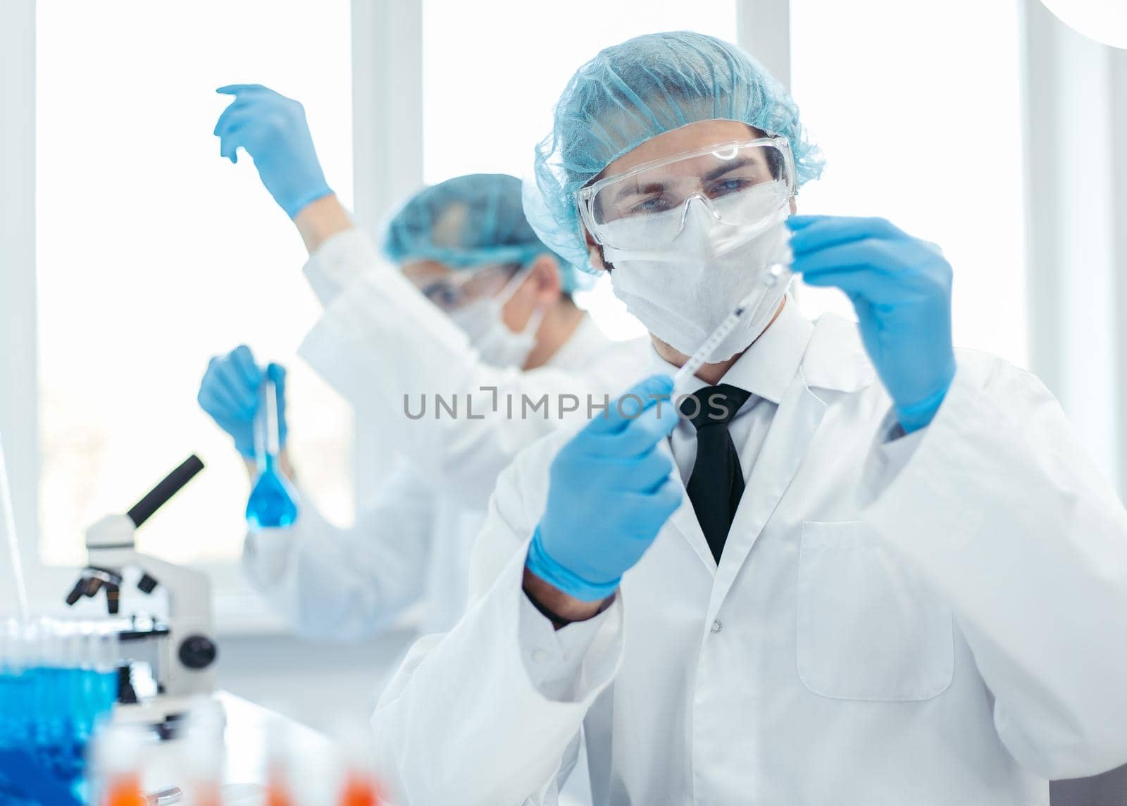 background image of a laboratory assistant in a medical laboratory by SmartPhotoLab