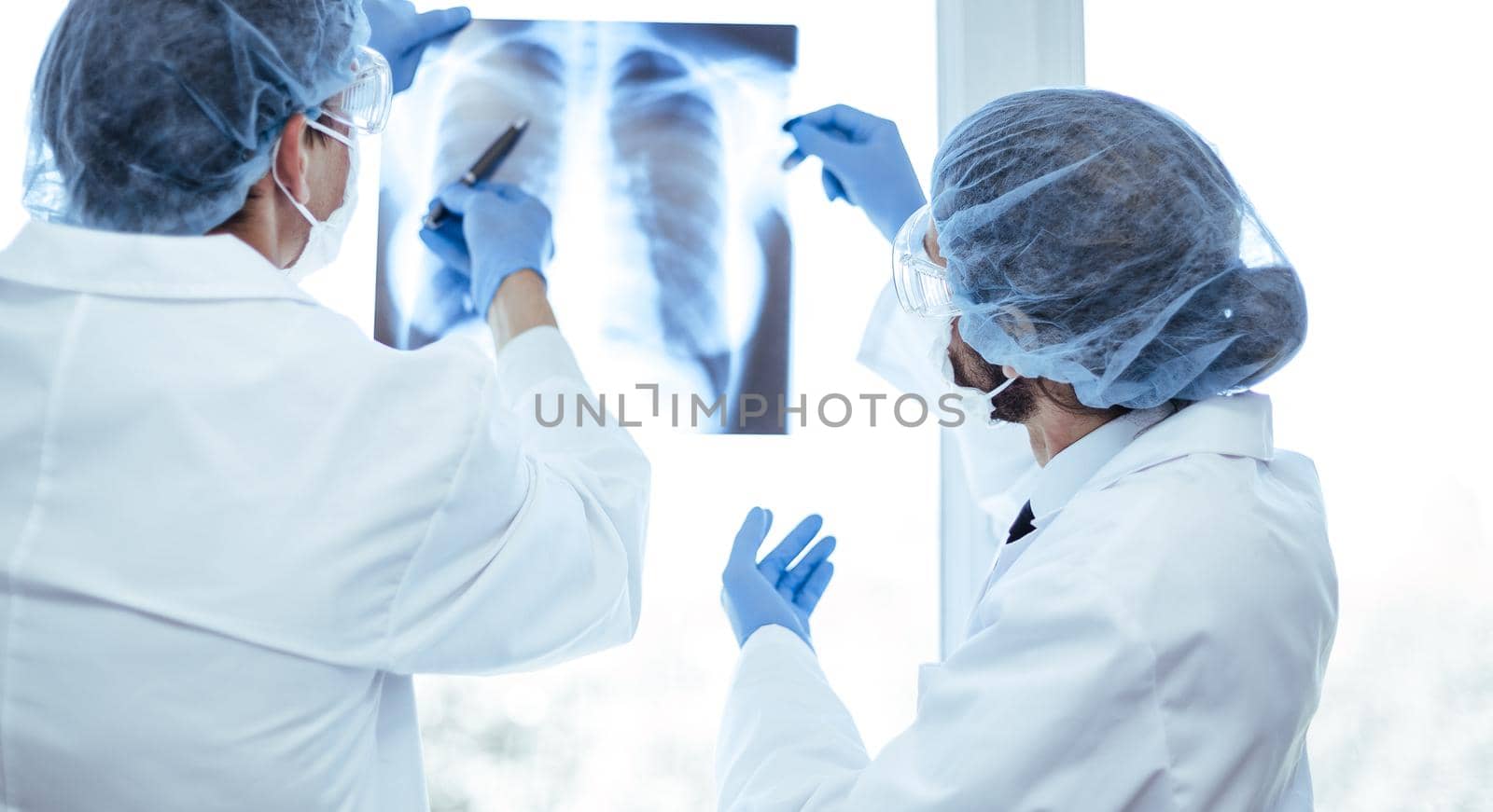 close up. medical colleagues discussing an x-ray of the lungs . concept of health care.