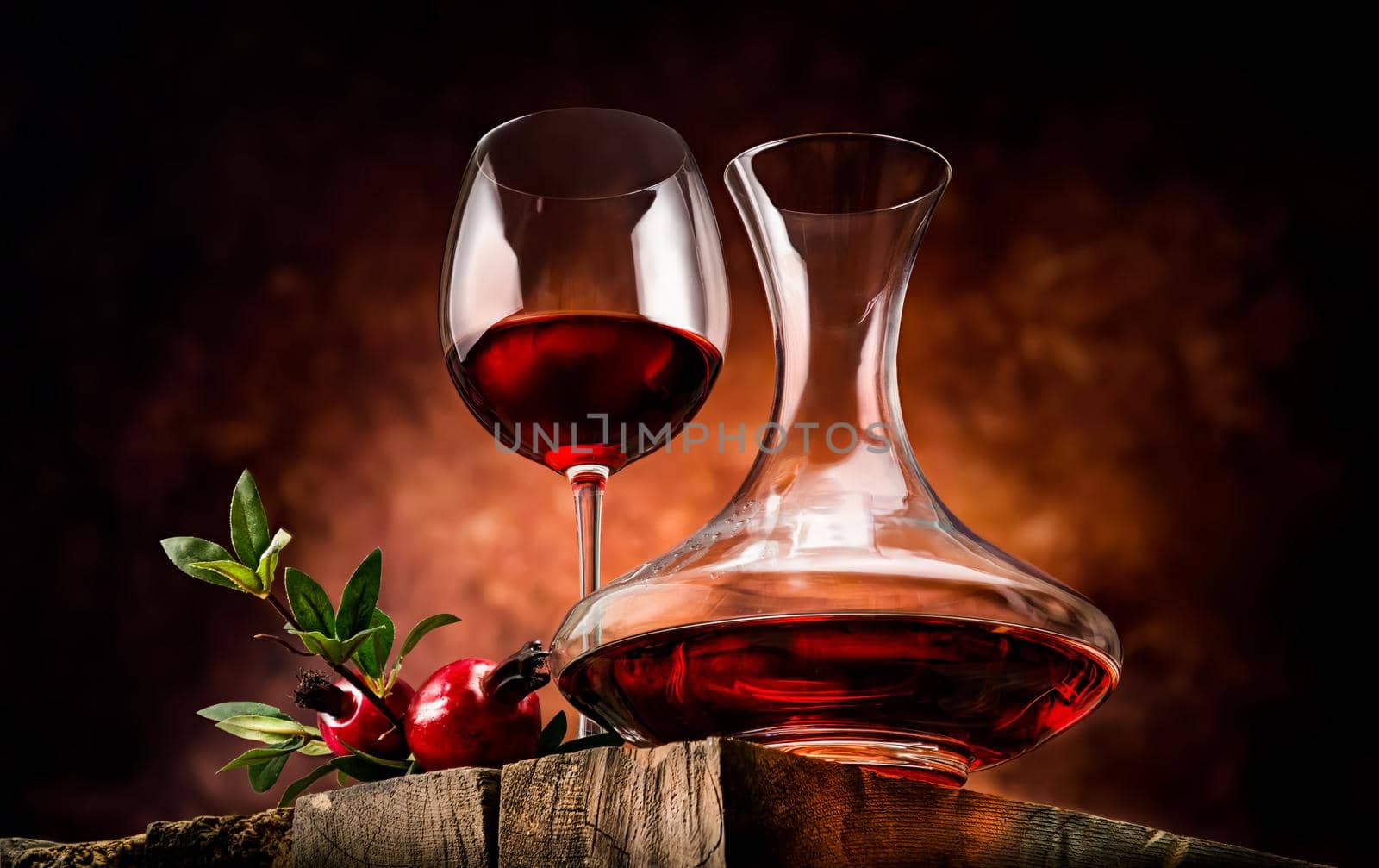 Pomegranate wine on a wooden table in a glass bowl