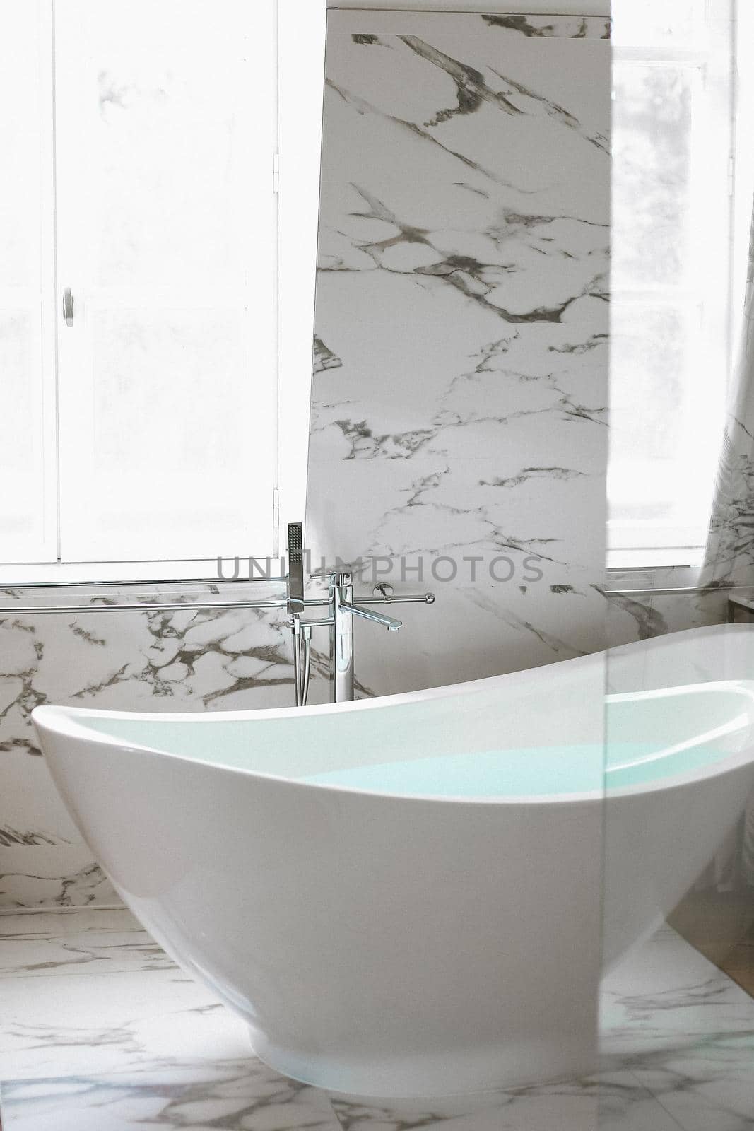 Modern bathroom with marble tile. Concept of interior design.