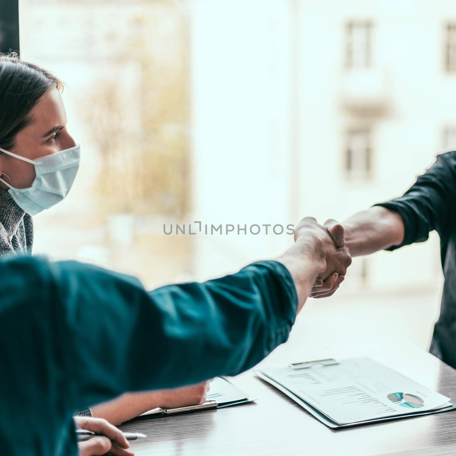 close up. financial partners are shaking hands with each other . by SmartPhotoLab