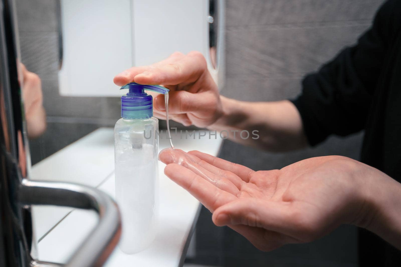close up. man using bactericidal hand soap. concept of prevention of infectious diseases.