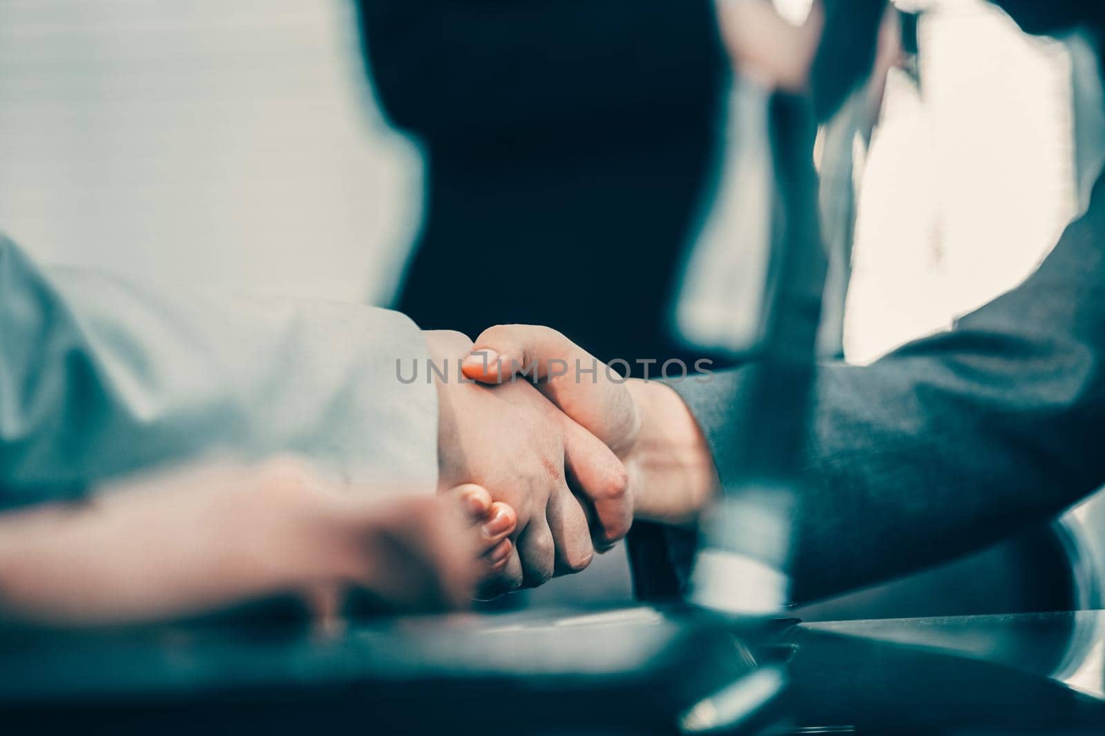 close up. business handshake during business negotiations. by SmartPhotoLab