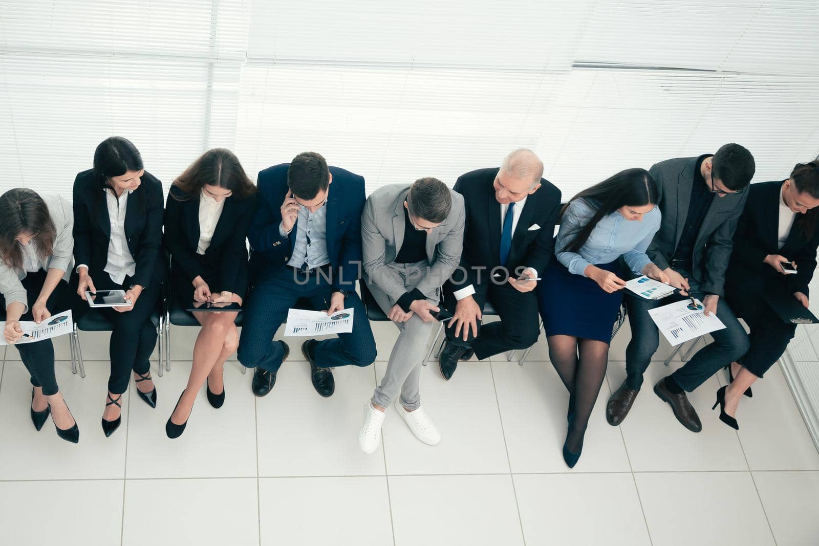 top view. young employees discussing financial data. photo with a copy of the space