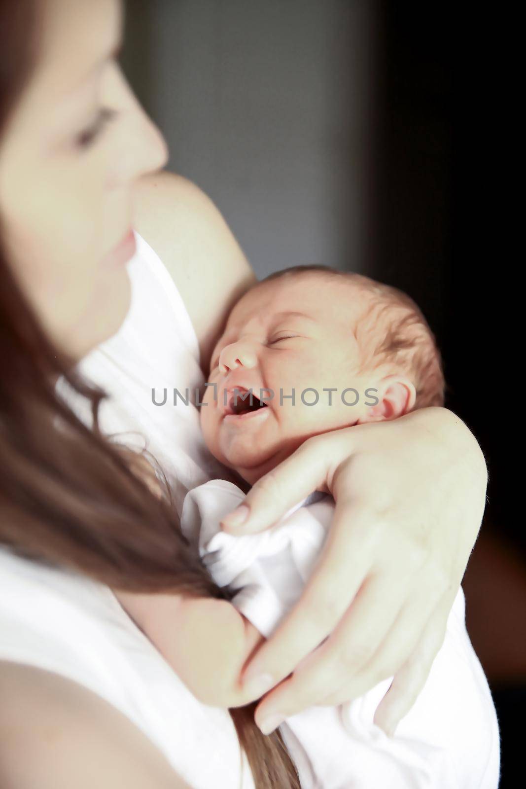 mother with newborn baby in the nursery