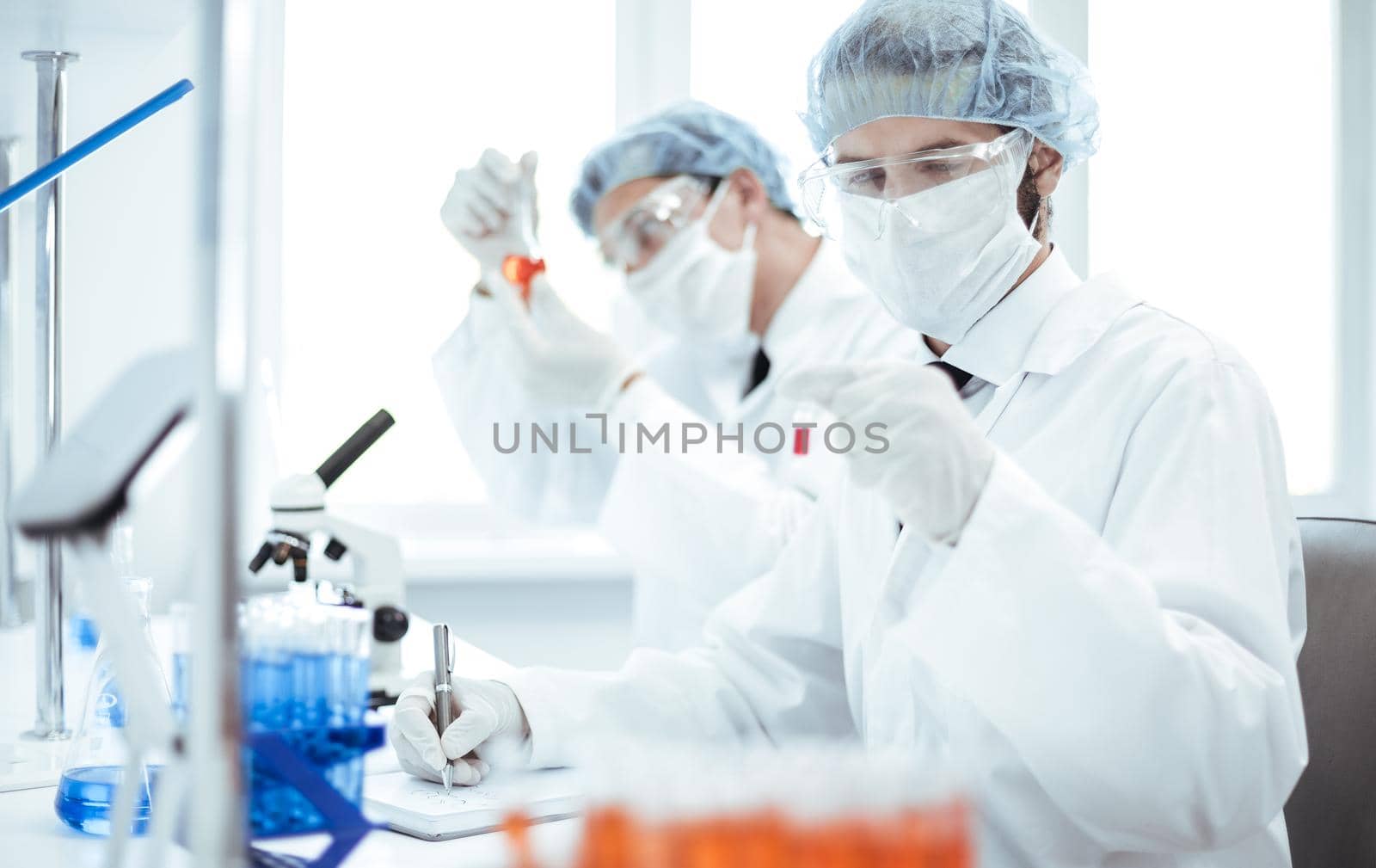 close up. group of laboratory technicians conduct testing in the laboratory . photo with a copy-space.