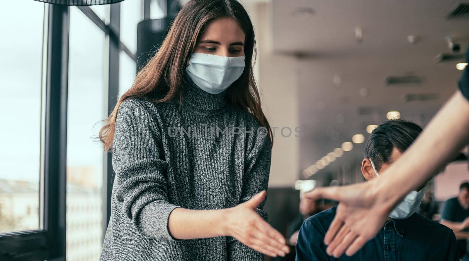 young employee holding out his hand for a handshake . by SmartPhotoLab