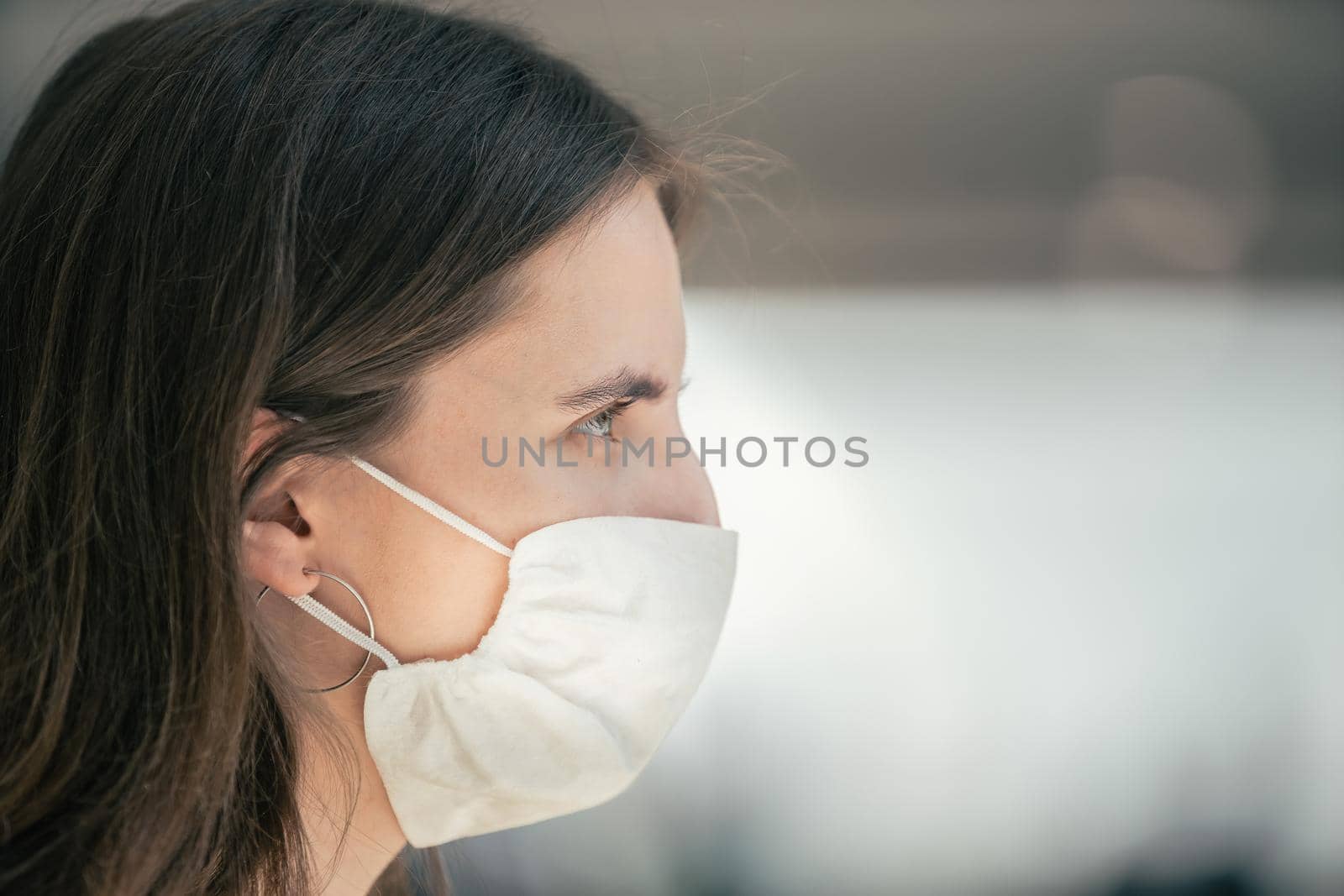 close up. a young woman in a protective mask by SmartPhotoLab