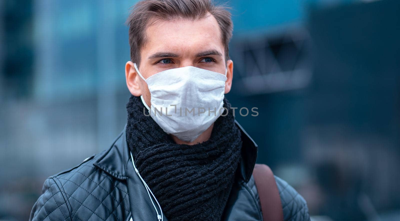 close up. a man in a protective mask on the background of a city street. by SmartPhotoLab