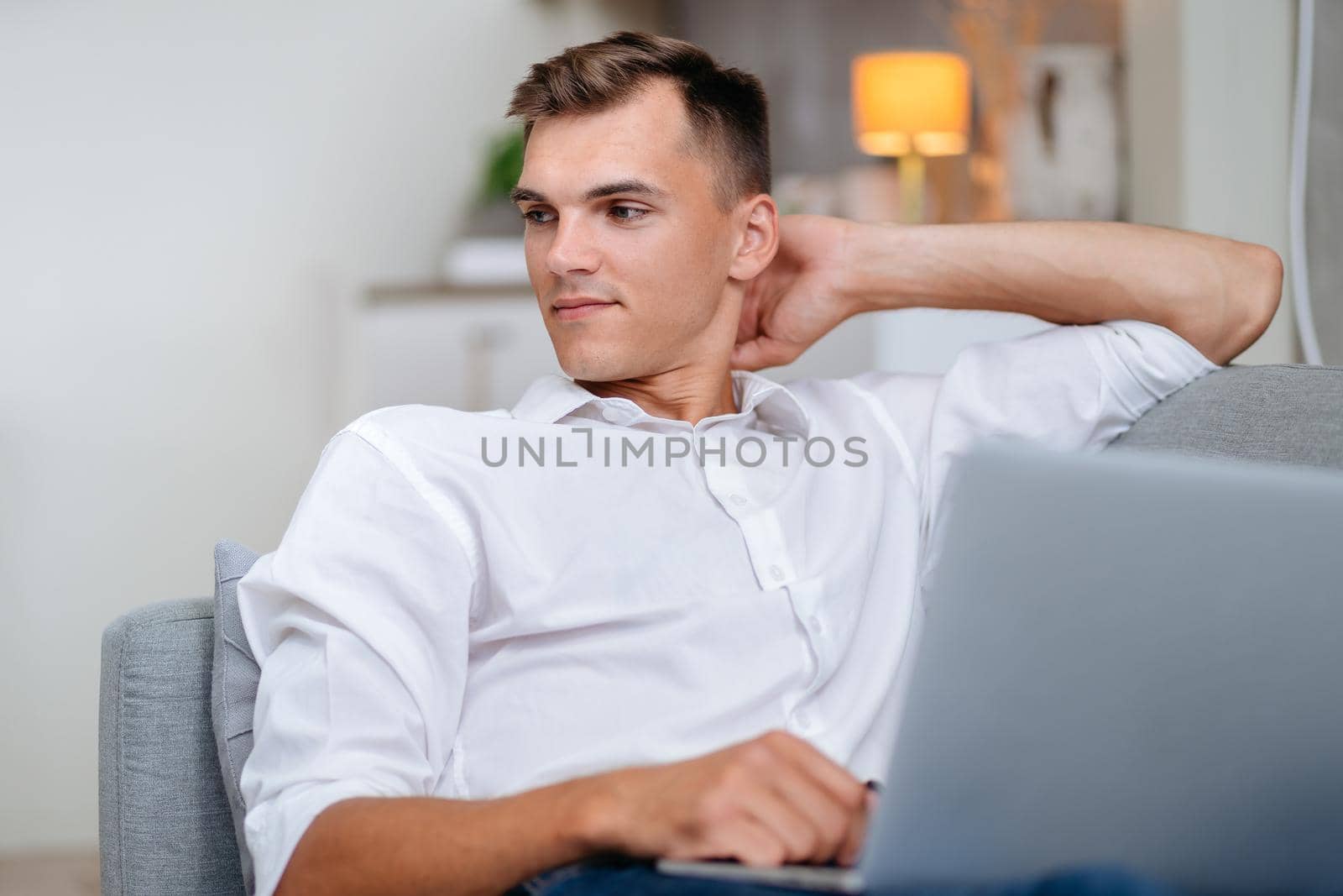 close up. attractive young man using his laptop . people and technology.