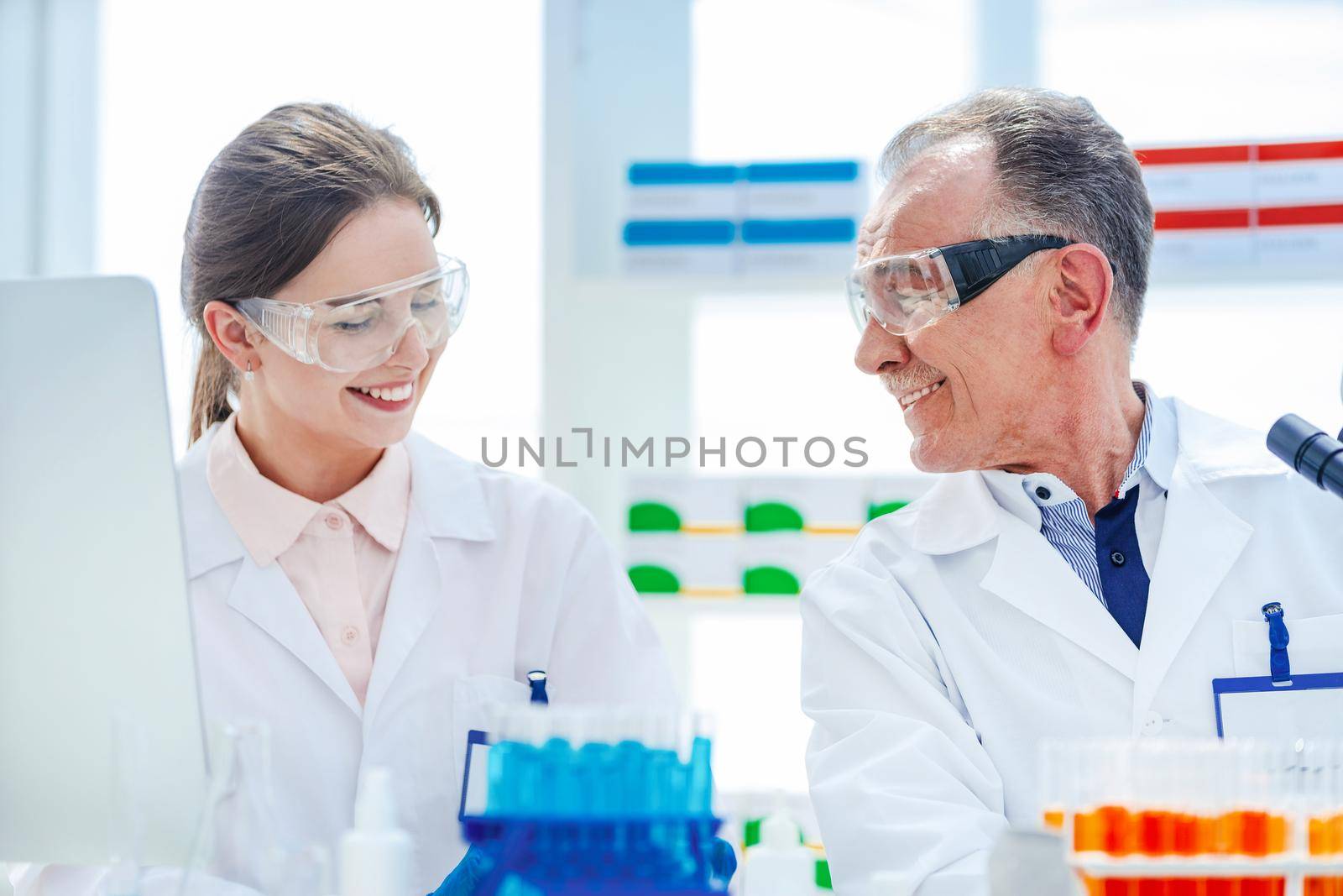 medical colleagues conduct research in the laboratory. by SmartPhotoLab