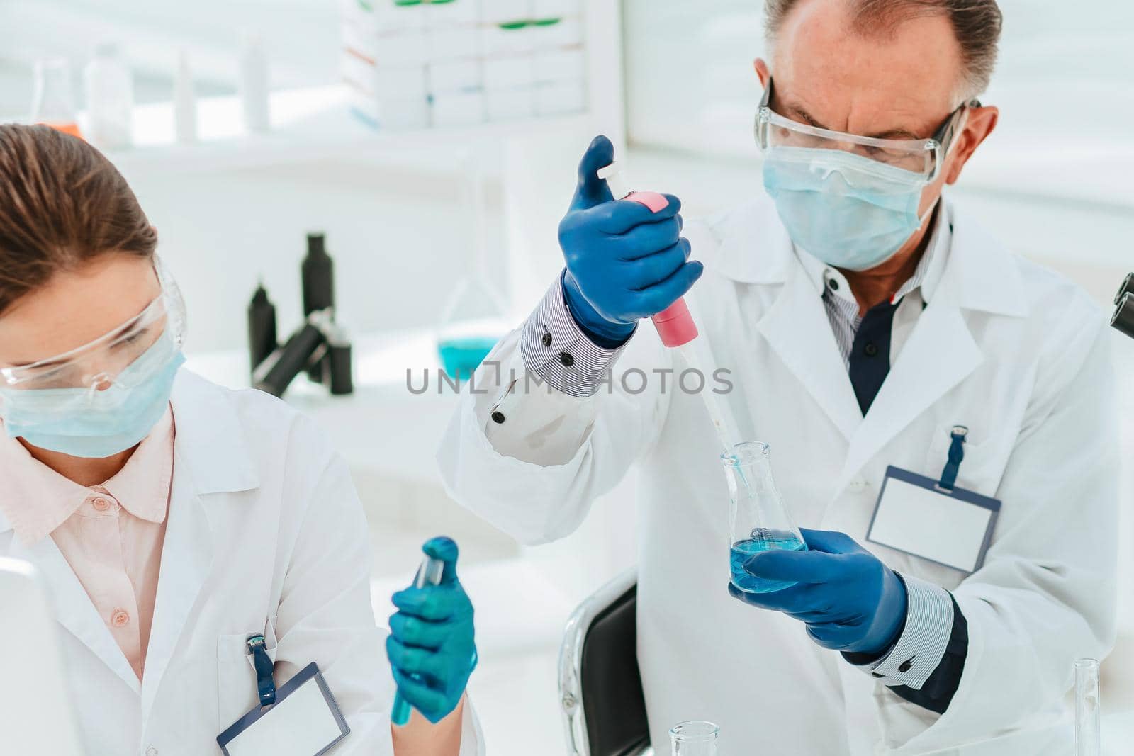 close up. researchers work with tests in the laboratory. by SmartPhotoLab