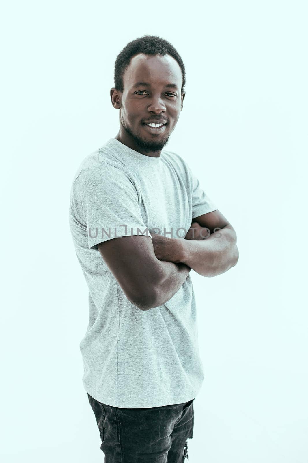 side view. confident guy looking at the camera. isolated on white background