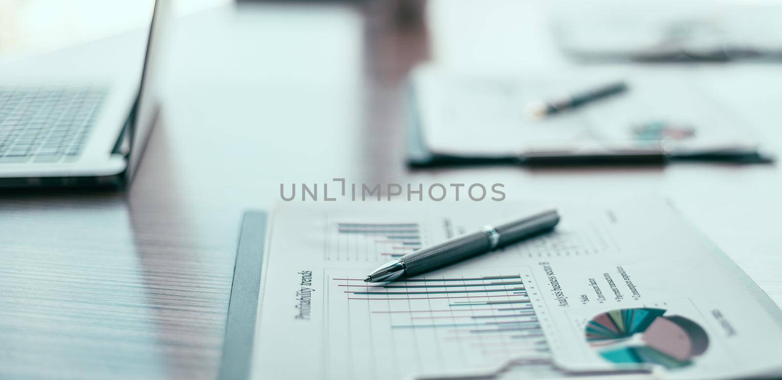 close up. financial chart and pen on the desktop. by SmartPhotoLab